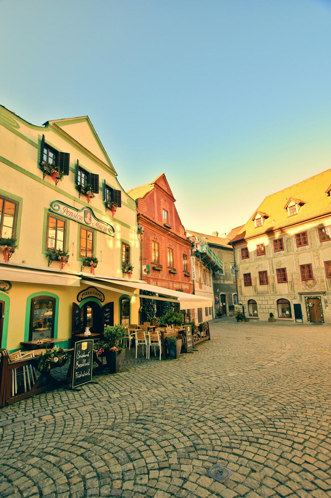 Historic European old town street with colorful townhouses in the morning